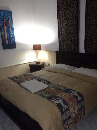 Ένα ή περισσότερα κρεβάτια σε δωμάτιο στο Meriki Apartment