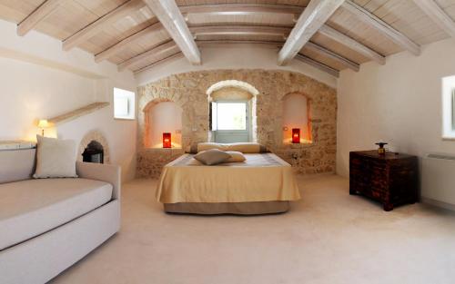 Postel nebo postele na pokoji v ubytování Palazzo Camarda B&B