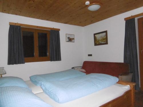 Katil atau katil-katil dalam bilik di Ferienhaus Römerhütte