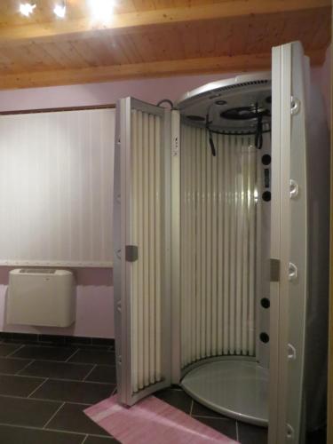 a bathroom with a shower with a glass door at Agriturismo Casale delle Lucrezie in Todi