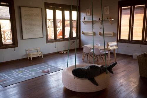 a room with a black cat laying on a chair at Sentidos Beach Retreat in Miramar