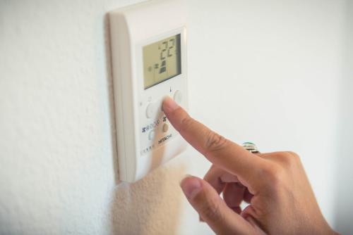 a person pressing a button on a light switch at ibis budget Troyes Est in Saint-Parres-aux-Tertres