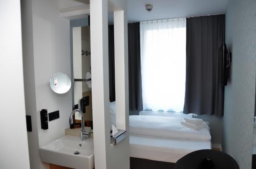 En eller flere senge i et værelse på mk | hotel münchen city