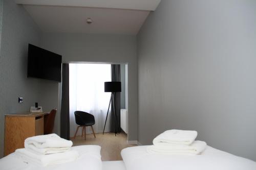 En eller flere senge i et værelse på mk | hotel münchen city