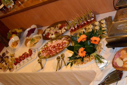 a table with many different types of food on it at Ubytování - U nás doma in Orličky