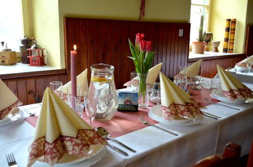 a table with plates of food on top at Ubytování - U nás doma in Orličky