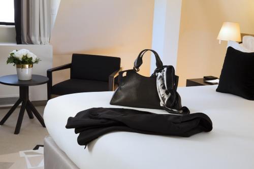 Postel nebo postele na pokoji v ubytování Boutique Hotel Des XV