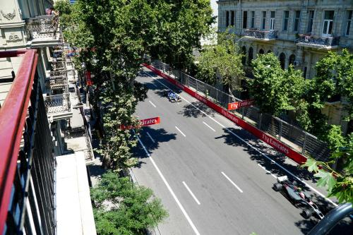 an aerial view of a city street with a bus at SAHIL Hostel & Hotel in Baku