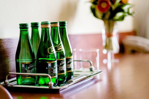 three bottles of beer sitting on a table at Hotel Stal in Stalowa Wola