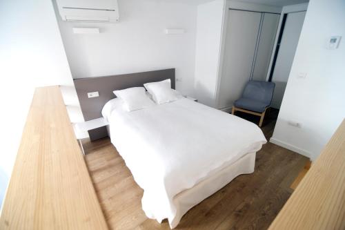 Ένα ή περισσότερα κρεβάτια σε δωμάτιο στο Smart Suites Albaicin