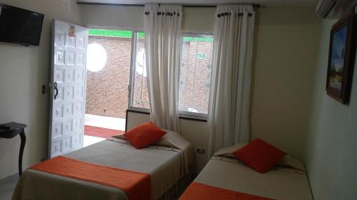 Ein Bett oder Betten in einem Zimmer der Unterkunft Hotel Napolitano
