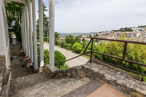 a balcony of a building with a view of a city at Villa Turística de Cazorla in Cazorla