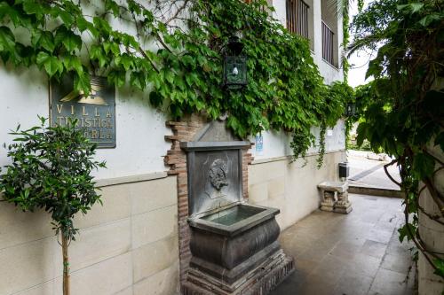 a statue on the side of a building at Villa Turística de Cazorla in Cazorla