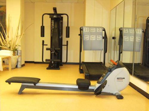 a room with a gym with a treadmill at Hotel Europa in Padova