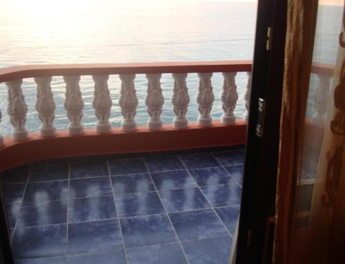 a balcony with a view of the water at Guest House Rusalka in K'obulet'i