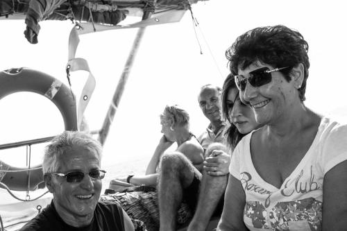 a group of people sitting on a boat at Su Connotu in Sestu