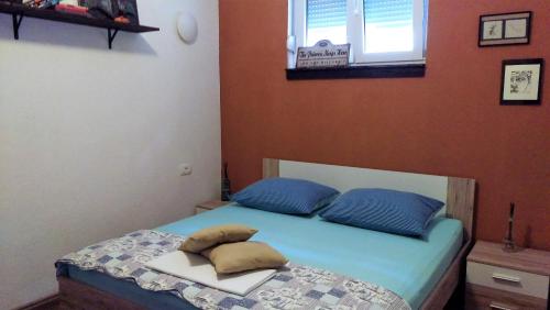 Ein Bett oder Betten in einem Zimmer der Unterkunft Apartman Rustico