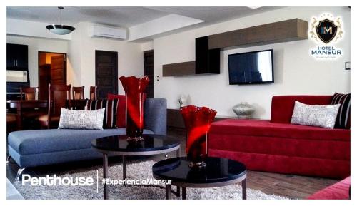 TV a/nebo společenská místnost v ubytování Hotel Mansur Business & Leisure