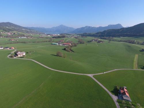an aerial view of a green field with a road at Pension Zenzlgut in Tiefgraben