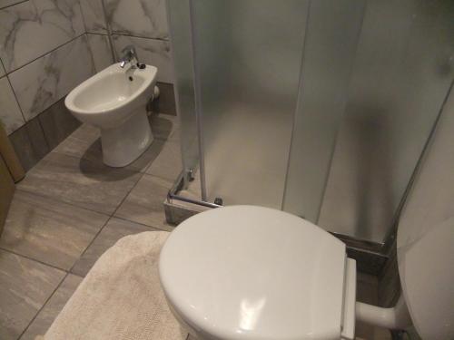 a bathroom with a toilet and a sink at Apartments Ivanković in Stari Grad