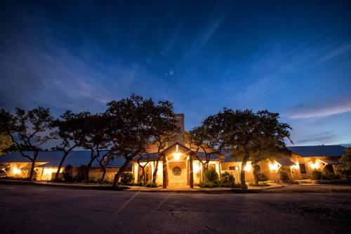 a church lit up at night with lights at Joshua Creek Ranch in Boerne