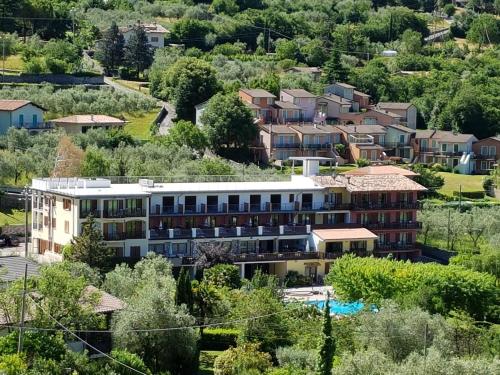 arial view of a building in a residential neighborhood at Park Hotel Val Di Monte ***S in Malcesine