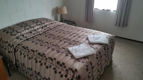 Postel nebo postele na pokoji v ubytování Stonehaven Motel