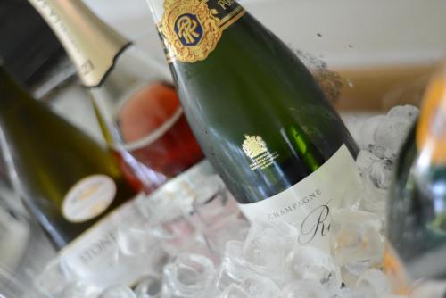a bottle of wine sitting on top of ice at Örserumsbrunn Gestgifveri & Konferens in Gränna