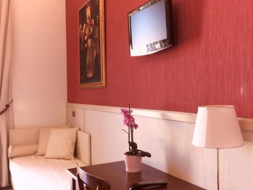 Basilica Hotelにあるテレビまたはエンターテインメントセンター