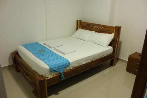 Una cama o camas en una habitación de Hotel Brisas del Nare