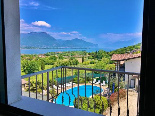 a view of a swimming pool from a balcony at Residence Bellavista in Manerba del Garda