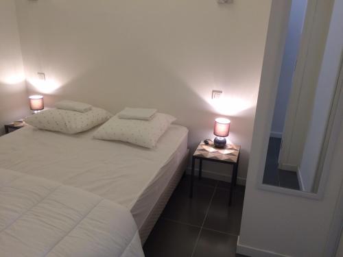 En eller flere senge i et værelse på Etoile De Mer