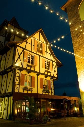 a building with lights on top of it at night at Colmar Tropicale in Bukit Tinggi