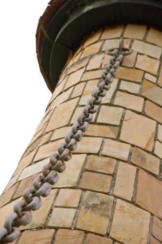 a brick tower with a chain on it at Colmar Tropicale in Bukit Tinggi