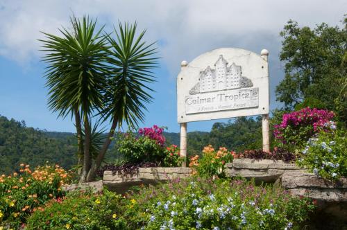 a sign for a garden theatre with flowers at Colmar Tropicale in Bukit Tinggi