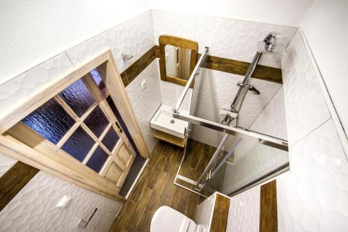 a bathroom with a staircase and a toilet at OH Apartments & Rooms in Ljubljana