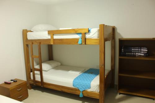 Una cama o camas en una habitación de Hotel Brisas del Nare