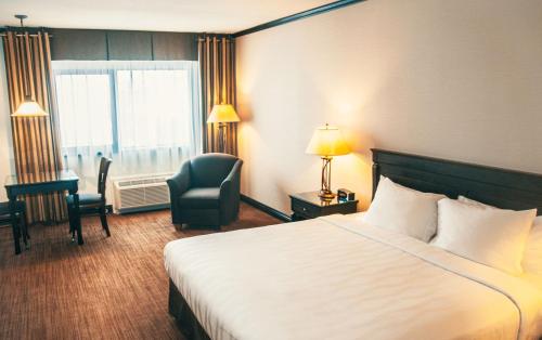 Postel nebo postele na pokoji v ubytování Hotel Le Montagnais