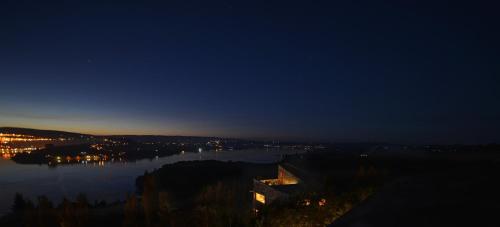 a view of a large body of water at night at OCIO Territorial Hotel in Castro