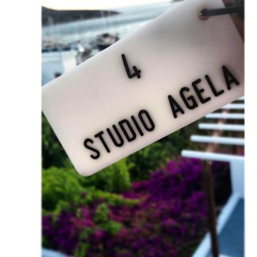 a sign that reads subo aalilla in front of flowers at Studios Angela Village in Lipsoi