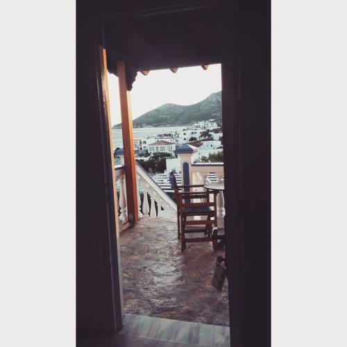 a view of a balcony with a table and chairs at Studios Angela Village in Lipsoi