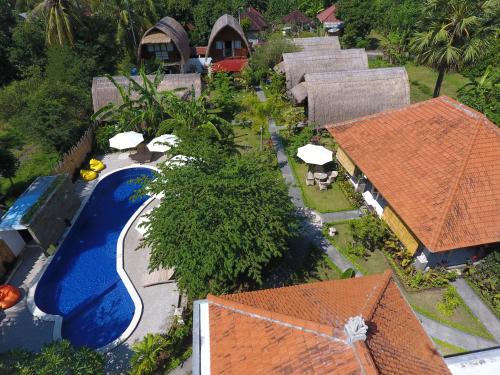 an aerial view of a resort with a swimming pool at Aura Villa & Spa Amed Bali in Amed