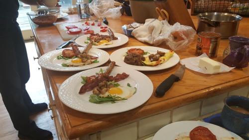a table with plates of breakfast food on it at Blackberry Inn in Camden