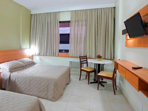 Katil atau katil-katil dalam bilik di Malibu Palace Hotel