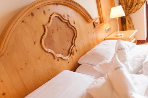 Postel nebo postele na pokoji v ubytování Royal Hotel Hinterhuber