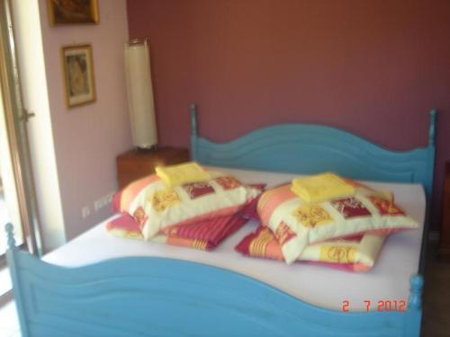 a blue bed with four pillows on it at 10 os - Gdansk-Sopot-Gdynia up to 19 persons in Gdynia
