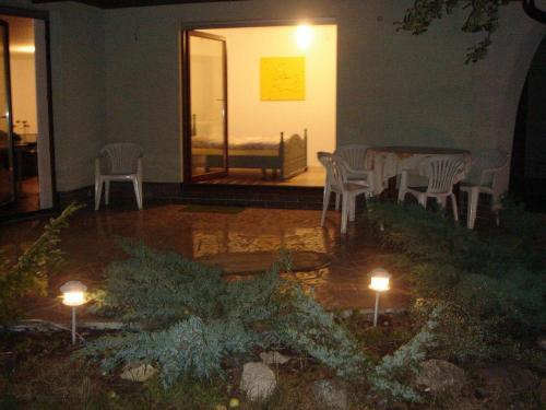 a room with a table and chairs and lights at 10 os - Gdansk-Sopot-Gdynia up to 19 persons in Gdynia