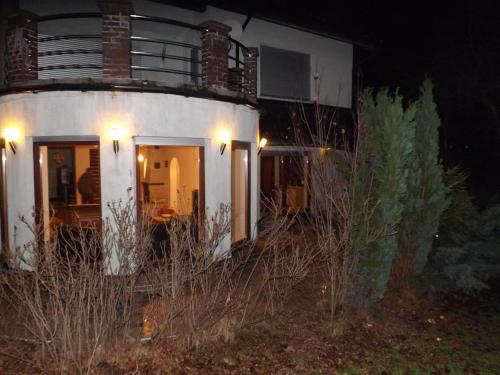 a white house with lights on the side of it at 10 os - Gdansk-Sopot-Gdynia up to 19 persons in Gdynia