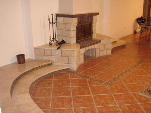 a room with a stone fireplace in a room at 10 os - Gdansk-Sopot-Gdynia up to 19 persons in Gdynia