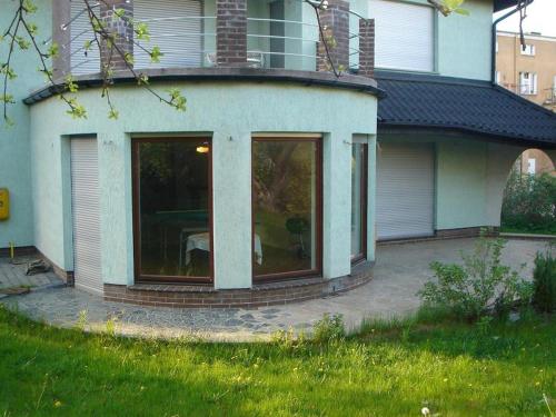 a house with large glass doors on the side of it at 10 os - Gdansk-Sopot-Gdynia up to 19 persons in Gdynia